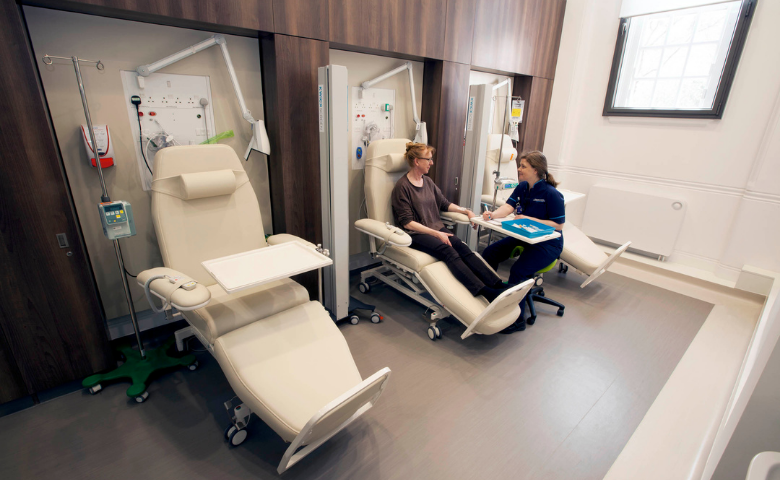 Patient sits on a chair at the Leonard Wolfson Centre for Experimental Neurology at UCL