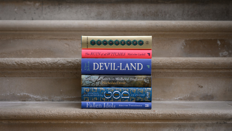 A stack of six hardback books shortlisted for the 2022 Wolfson History Prize. The books are piled on top of each otheron a set of stone steps