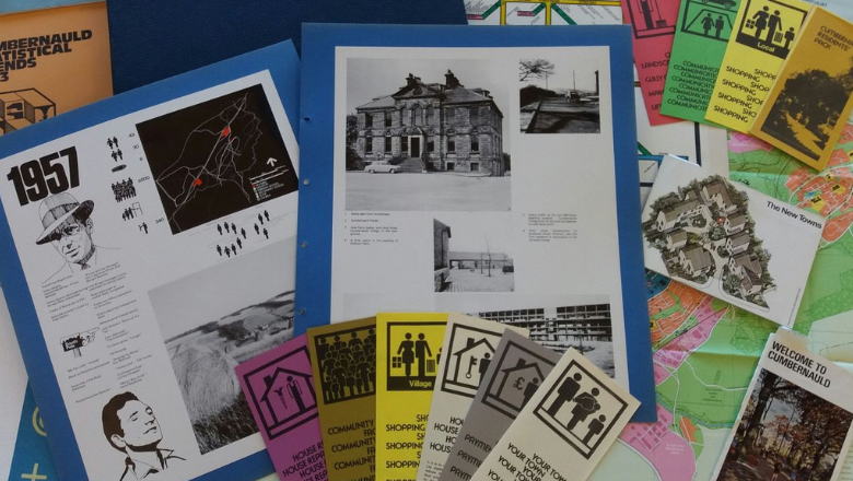 A pile of books, leaflets and archival material scattered on a table.