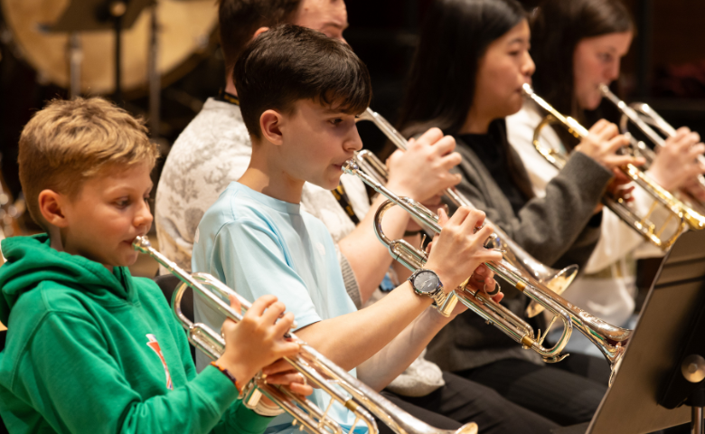 Credit Hope Holmes/Royal Conservatoire of Scotland Five young people at the Royal Conservatoire of Scotland playing the trumpet.